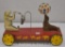 Pressed steel circus wagon with seal balancing ball and bear playing bell gong