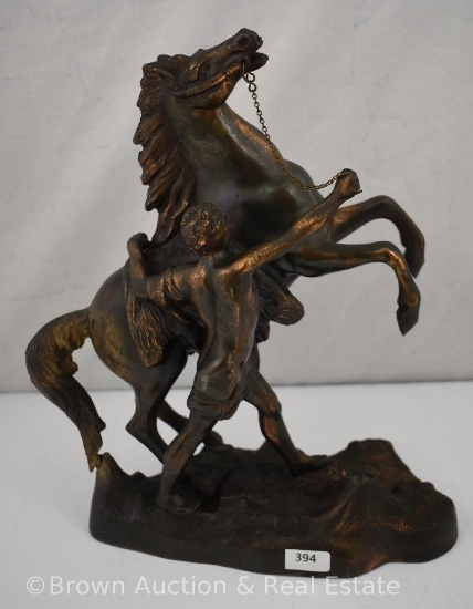 12" sculpture of partly nude man holding rearing horse by bridle