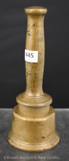 Solid brass pestle of some sorts with holder