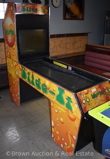 "Slide-It" coin-operated arcade game, has key