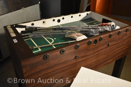 Foosball table, coin-operated, has key
