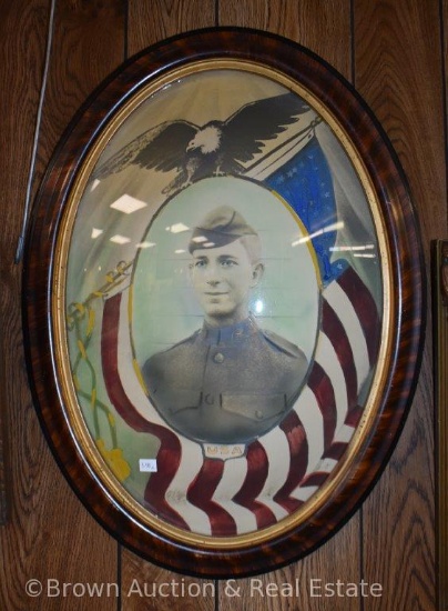 Painted (probably watercolor) picture of WWI soldier Joel Vaughn in oval, bubble glass frame