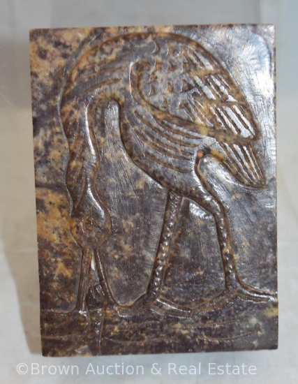 Soapstone trinket box with carved design of crane eating fish on lid