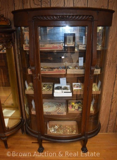 Curved glass china cabinet with paw feet