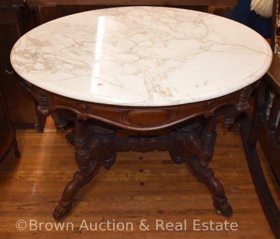 Marble top parlor table, very ornate base and legs