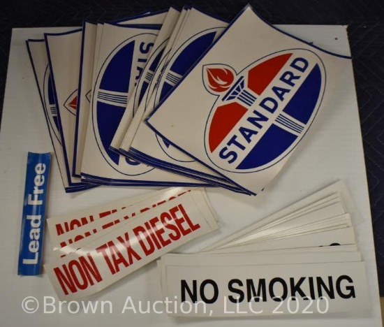 Box of assorted vinyl gas related signs