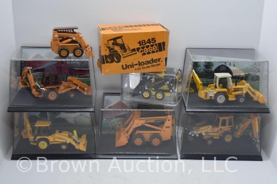assortment of die-cast Skid-loaders and Back-hoes