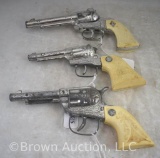 (3) Toy cap guns, plastic grips