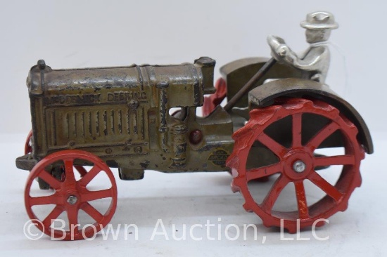 McCormick-Deering Arcade cast iron tractor with driver