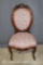 Victorian upholstered sidae chair, ornately carved wooden frame and crest
