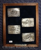 (4) Charles M. Russell collector belt buckles on plaque