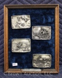 (4) Charles M. Russell collector belt buckles on plaque