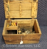 Old wooden box with early reloading equipment and paper shotgun shells
