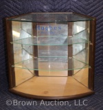 Hughes Brushes store display cabinet with curved glass front