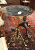 Round coffee table w/marble top and ornately decorated brass base