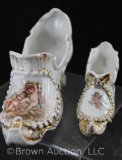 (2) Victorian decorated porcelain shoes with gilt trim, cherubs