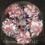 John Gentile glass paperweight, pink and white flowers on multi-color cushion, 3.5