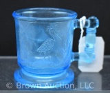 Blue glass child's cup decorated with Peacock and Stork
