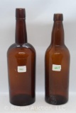 Amber whiskey bottle and beer bottle