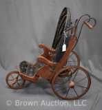 Vintage child's stroller, wood framed