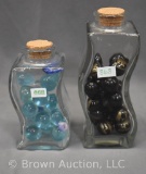 (2) Clear glass jars full of marbles - black ones are mostly John Deere