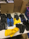 Pairs of Assorted fins and shoes