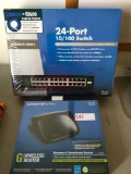 New Linksys wireless router and a 24 port 10/100 switch, 2 pieces
