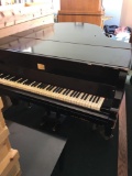 European made Grand piano with bench and moving dolly, exact origin unknown