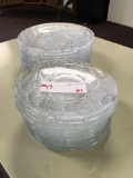 5 1/2 in. glass saucers and 7 in. glass plates, 23 pieces