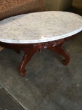 Oval table with granite top, 34 inch x 22 inch