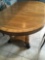 Wood oval dining table with pad and table cloth, 46 in. X 82 in.