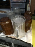 Assorted pitchers and plastic glasses