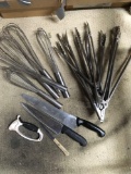 Assorted utensils, tongs, whisks, knives, sharpener