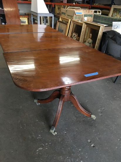 Vintage dinning table on casters. It has two more leafs. See second pic