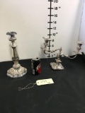 Ornate silver candle holders. The one with two candle holders has stamp 