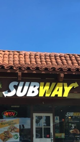 Large Neon  "Subway" sign ( it is outside building)