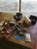 Assorted items. Belt buckle, belt, wagon, lighters, etc