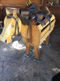 Saddle stand horse and saddle. (Gazebo area)