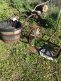 Wagon Wheels and Wooded barrel yard deco( outside garage area)