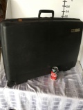 Large Delsey rolling brief case with combination (222) and keys