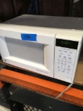 GE turn table microwave oven. Turned on