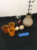 Vase, 3) small yellow candleholders, 2) Stone eggs