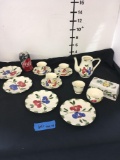 Flower design. Tea cups, sugar bowl, saucers, small plates, tea pot