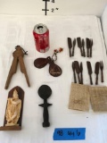 Wood nut cracker, pair of caste nets, 2) small figurines 2) sets of small wood fork knives