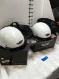 Harley Davidson Helmets 1 Medium and 1 XXL with tags and storage bags.