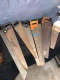 Assorted size hand saws and machete
