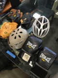 3) baseball Gloves Right & Left handed. 2) bike helmets 1) pair of boxing gloves