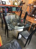 Dining Set - 6 chair Glass top table sits on leather pedestals. Glass top 78