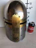 New, metal helmet with gold finish accents