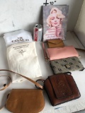 Lot. Wall art, 2) Michael Kors wallets, 1) Dooley Bourke wallet. 2) protective bag covers 2) small